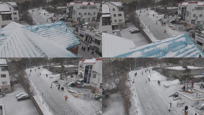 航拍威海国际海水浴场火炬八街冬季游客雪景