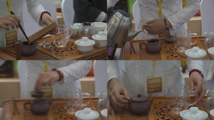 茶博会上的女茶艺师在泡茶给宾客饮用