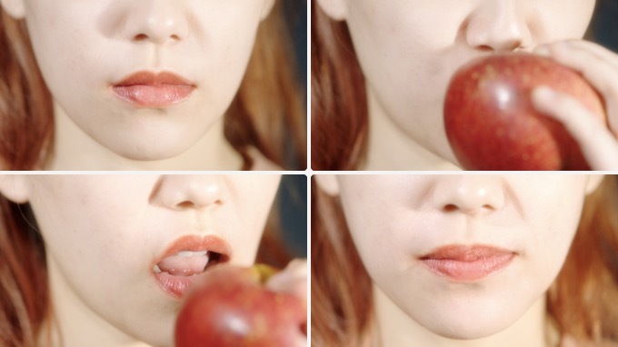 涂口红的女孩儿吃苹果 嘴部特写