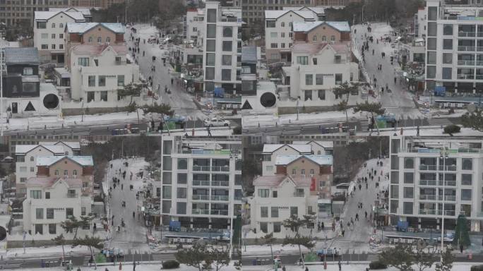 航拍威海国际海水浴场火炬八街雪景游客公路