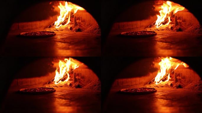 比萨炉里的木头在燃烧。特写镜头