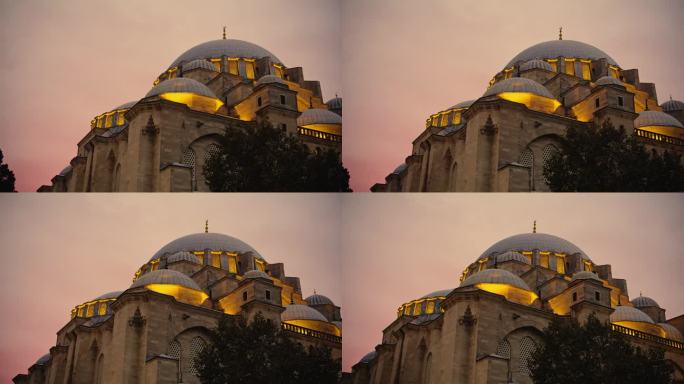 被照亮的苏莱曼清真寺在黄昏的天空中闪闪发光，创造出迷人的夜景