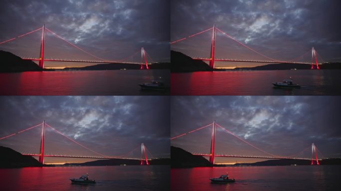发光的Yavuz Sultan Selim大桥照亮了博斯普鲁斯海峡，而摩托艇在夜晚行驶