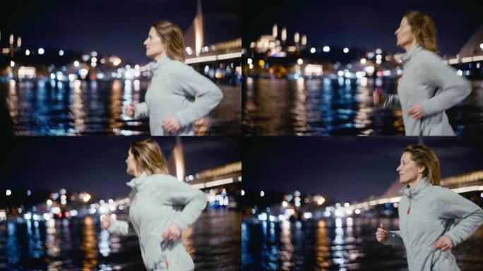 在波光粼粼的博斯普鲁斯河和夜晚模糊的城市灯光旁奔跑的女人