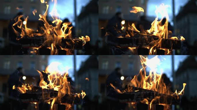 超级慢动作催眠火焰在800 FPS -篝火温暖在城市中心，发光的余烬