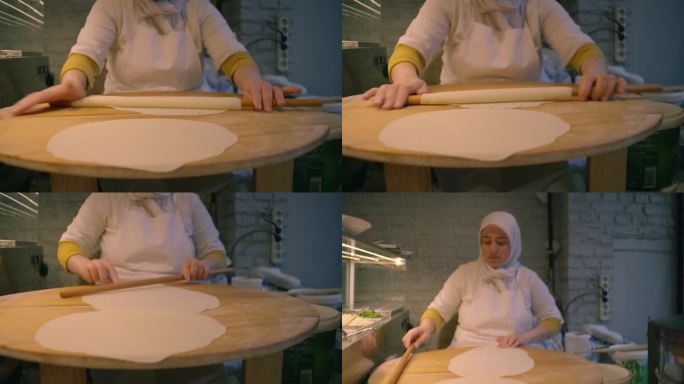 一名妇女在当地面包店熟练地准备美味的土耳其戈兹莱姆