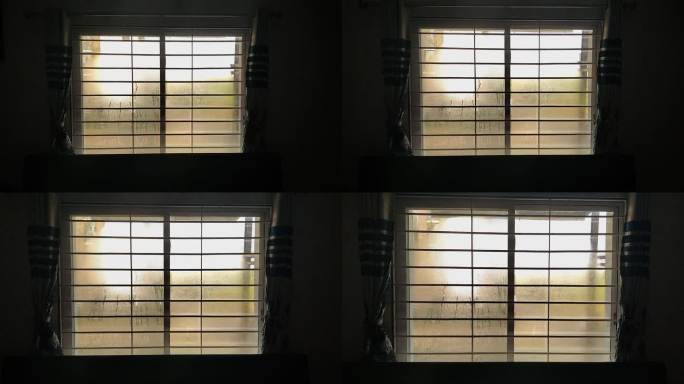 暗室里的照相机带着雾蒙蒙的水珠慢慢靠近窗玻璃