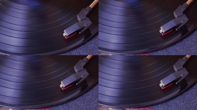 唱机转盘上黑色黑胶唱片的转盘头。记录在旋转。从上面看