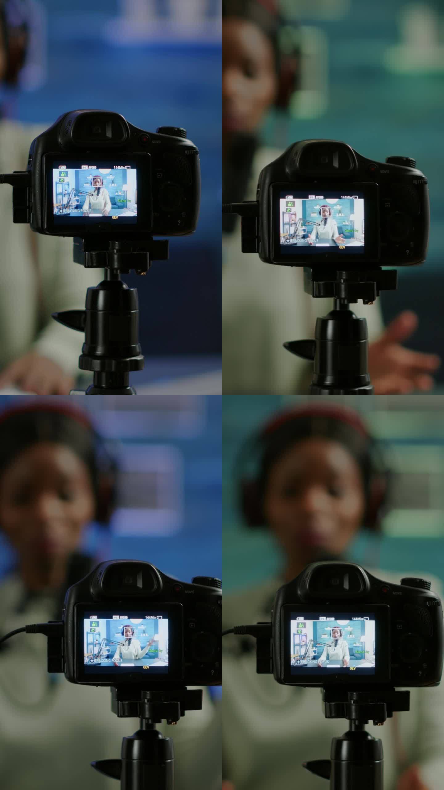 垂直视频:坐在单反相机前的专业相机的特写
