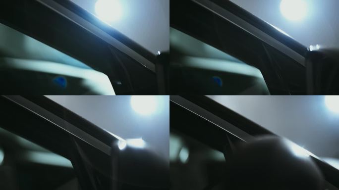 近距离镜头盘反光表面闪亮的一个全新的汽车前车窗镜头耀斑