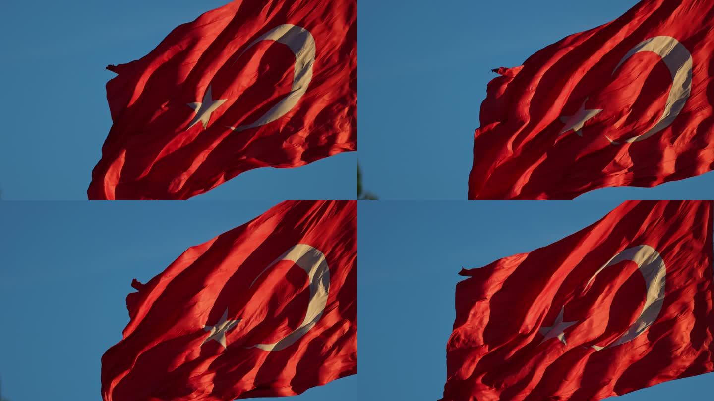 观看土耳其国旗在充满活力的蓝天下轻轻摇曳，这是国家荣誉的时刻