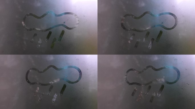 孩子用手指在雾蒙蒙的玻璃窗上画云和雨