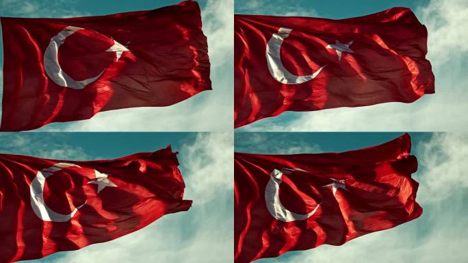 在晴朗的日子里，土耳其国旗在多云的天空下摇摆的低角度锁定镜头