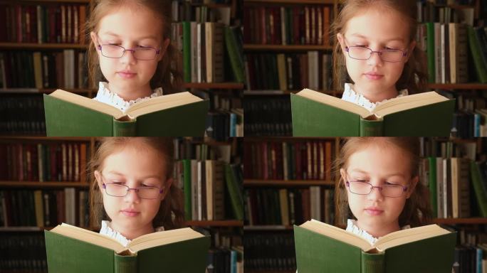 小女孩在图书馆看书。书店里的孩子