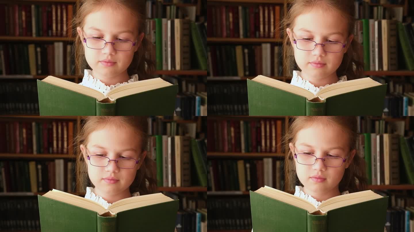 小女孩在图书馆看书。书店里的孩子