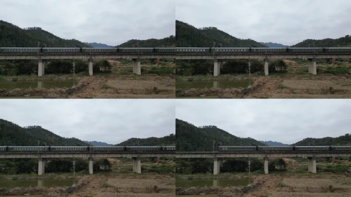 绿皮火车火车经过铁路桥梁