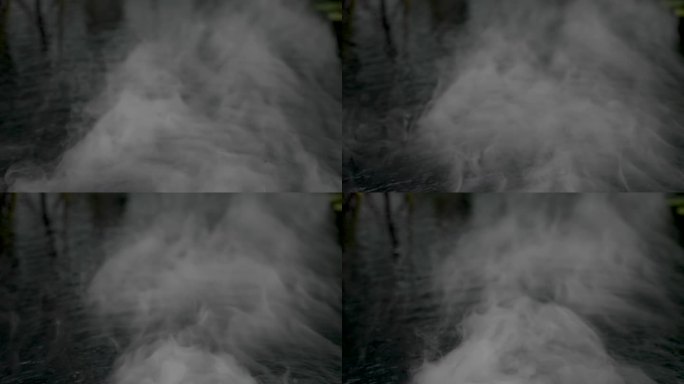 雾烟在水面上滑行。慢镜头