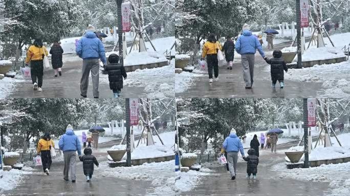 下雪中行走的人群背影