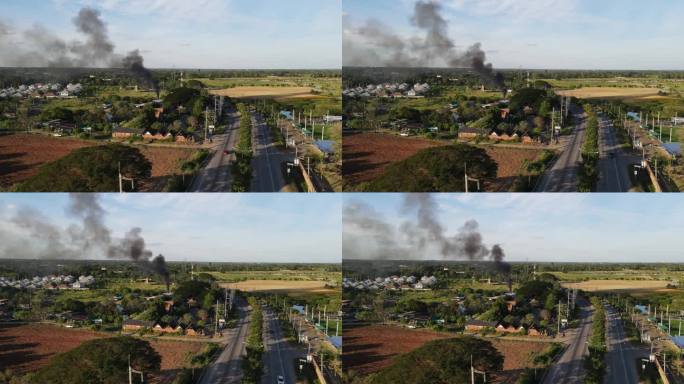 鸟瞰图社区中心燃烧的大火产生的黑烟造成无人机造成的空气污染