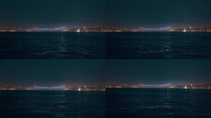 土耳其伊斯坦布尔，夜晚晴朗的天空下，船在马尔马拉海上的博斯普鲁斯大桥上的视角