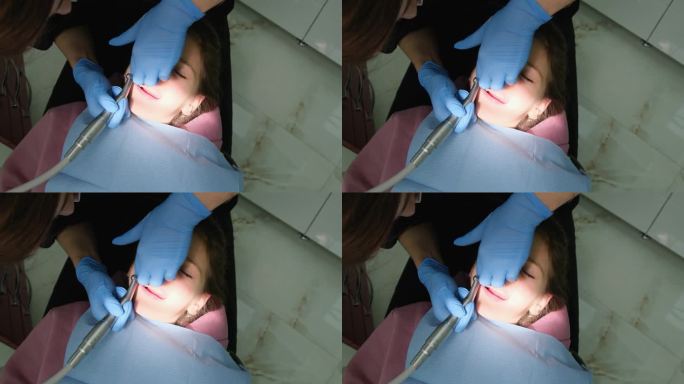 牙医给一个小女孩装牙套。