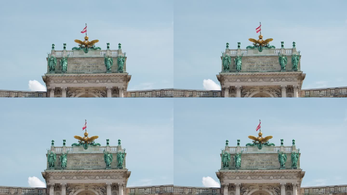 奥地利维也纳，霍夫堡顶上的旗帜和雕塑