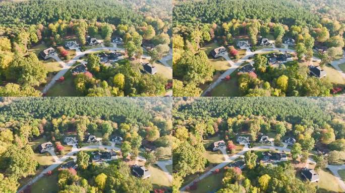 在南卡罗来纳郊区，从高处俯瞰黄色秋天树木之间昂贵的住宅。美国梦之家是美国郊区房地产开发的典范