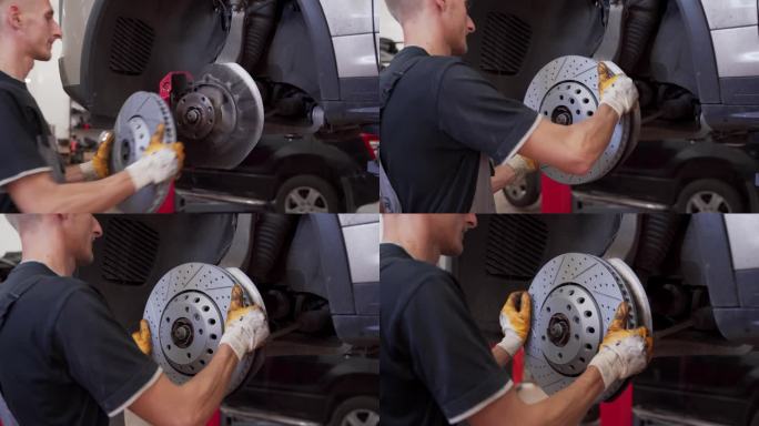 汽车修理工在车上安装新的刹车盘。汽车修理厂的维修过程。用手将磨损的转子更换为高性能部件。制动系统的保