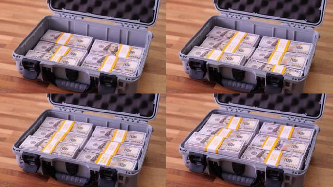敞开的手提箱里装满了百万美元的钞票