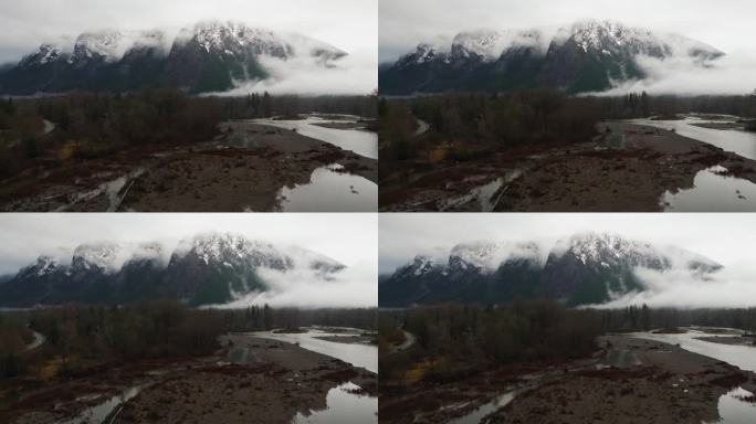 4K无人机镜头转发视频雾蒙蒙的雪山在冬天。太平洋西北