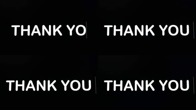 在电脑屏幕的黑色背景上，用大写和黑体字编码单词thank you的字母。