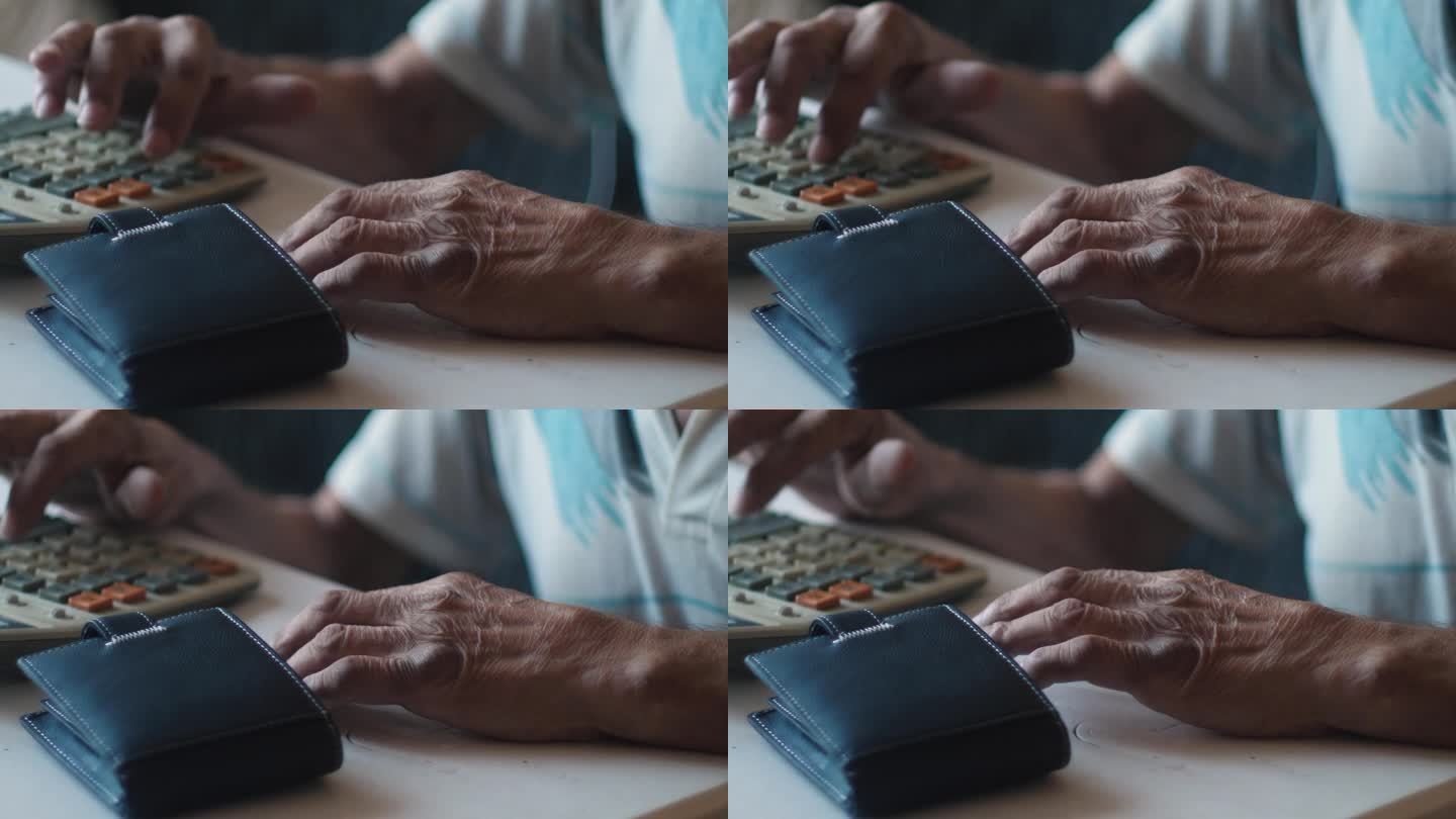 一位老人把钱包放在桌子上，用计算器计算费用和收入、养老金领取者的纳税义务、银行存款、养老金领取者的人