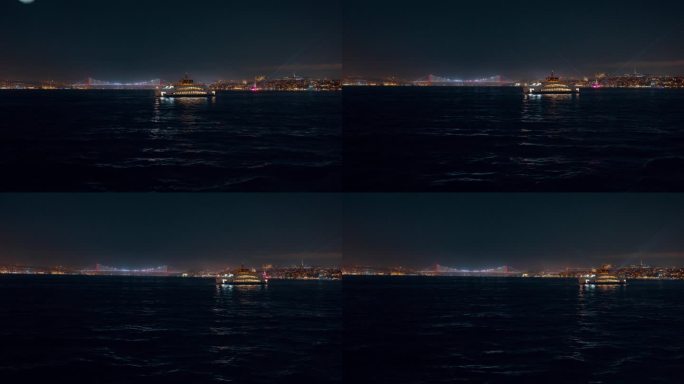 船的POV照明游轮在马尔马拉海与博斯普鲁斯桥对晴朗的天空在夜间在伊斯坦布尔，土耳其
