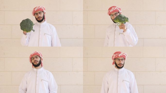 阿拉伯男子拿着花椰菜，脸上带着微笑，以一种有趣的方式讲述着吃蔬菜的好处