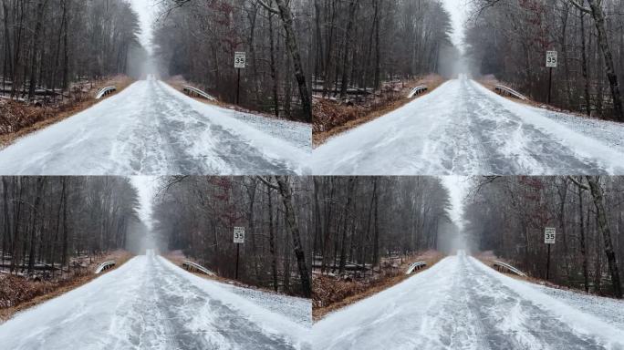 东北风期间，一场大雪落在了偏远而美丽的森林道路上