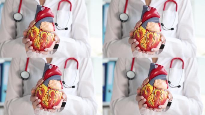 医生手里拿着人造人造心脏，近距离4k电影慢动作