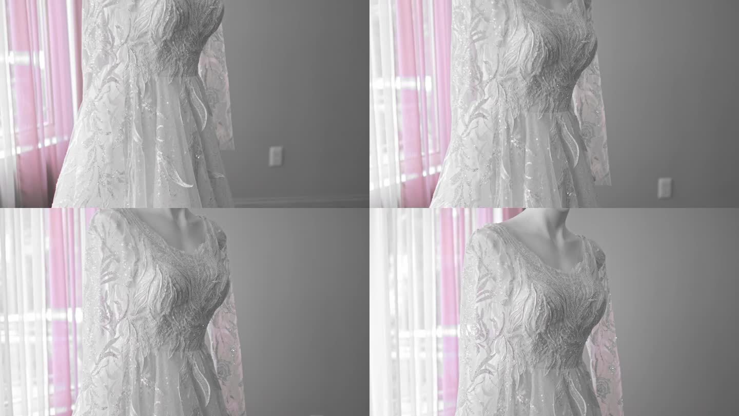 一个疯子穿着白色婚纱的特写镜头。背景中有粉红色的窗帘
