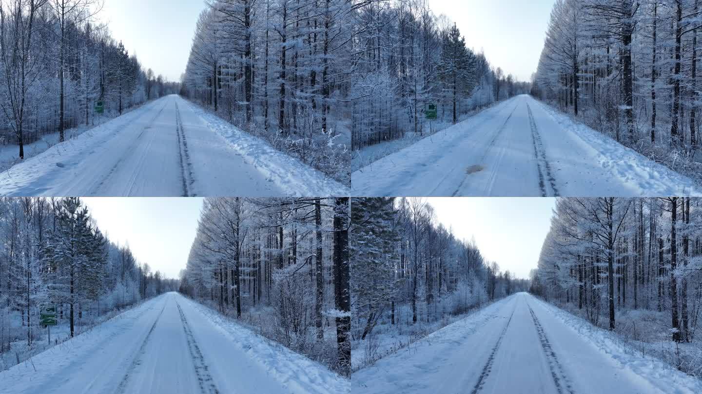 航拍冬季冰雪路面雪路林间道路