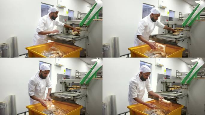 一家工业面包店的男工人正在整理装在塑料袋里的面包