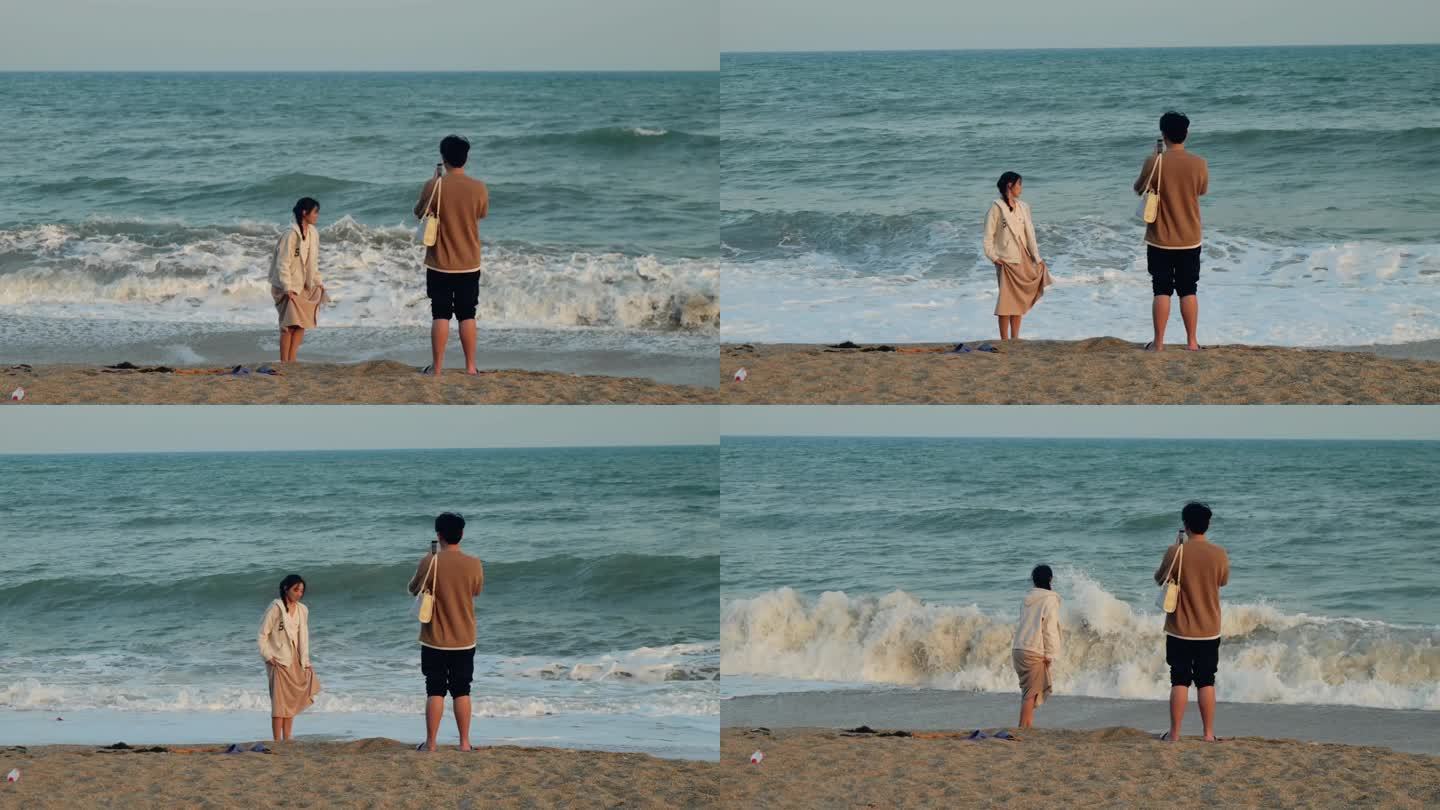 情侣在海边拍照