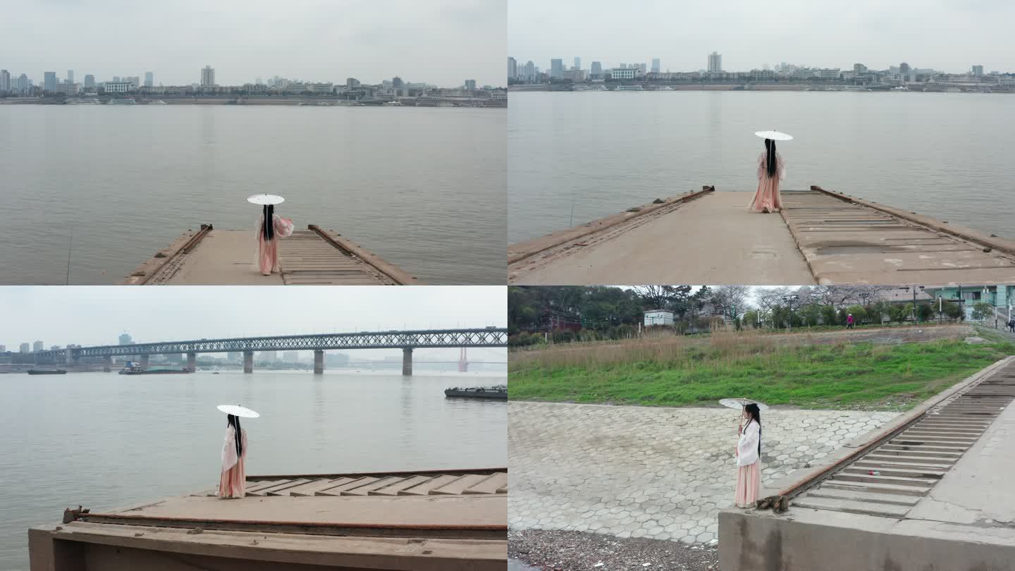 古装汉服女子在武汉汉阳长江大桥旁江边赏景
