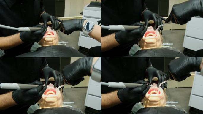 牙科诊所的医生在牙科治疗期间冲洗病人的口腔。