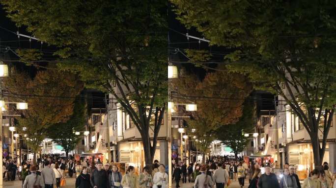 一群人在日本京都的竹屋商街夜生活购物