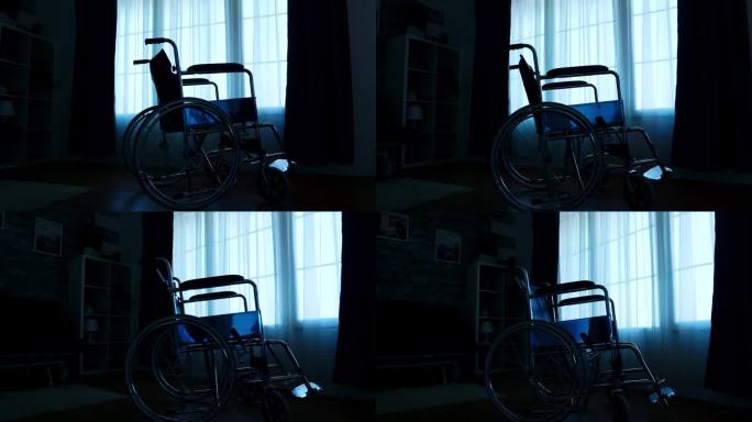 医院轮椅的剪影在黑暗的房间里