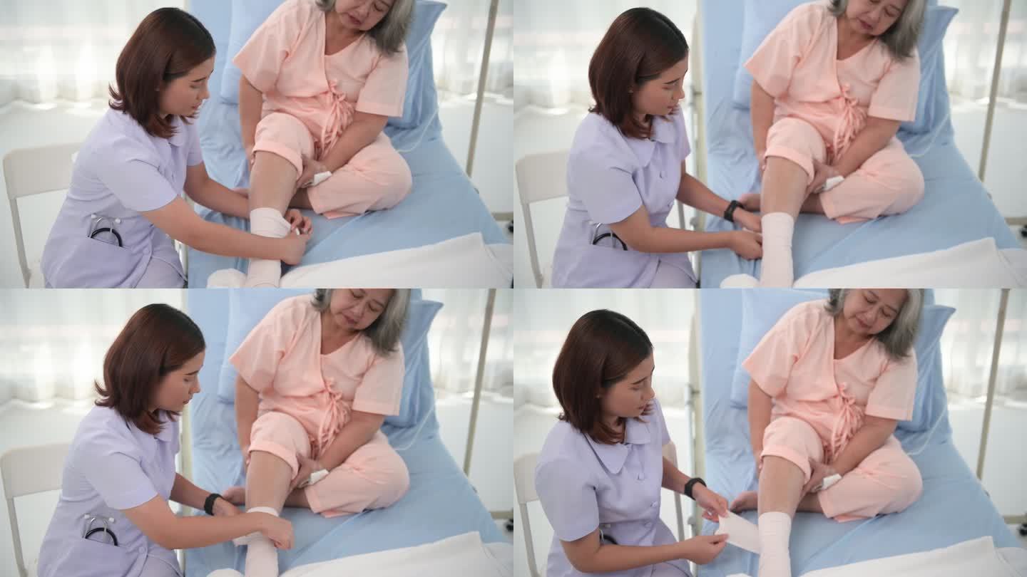 亚洲女护士为老年妇女病人包扎足部