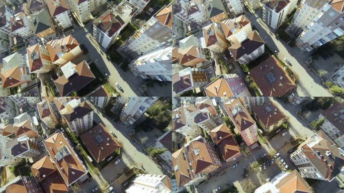 自上而下的城市街区。沿着伊斯坦布尔郊区的建筑飞过街道和房屋。空中摄像机拍摄的屋顶航拍视频