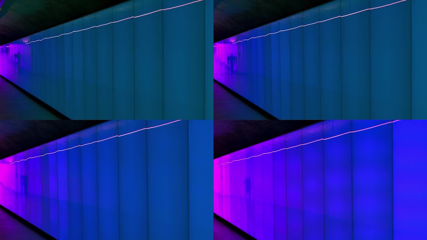 行人在现代变化的蓝粉照明地下隧道中的影子