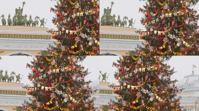 主圣诞树上闪烁着彩灯的装饰，城市的中央宫殿广场在降雪期间装饰的庆祝活动，总参谋部拱门，武装部队的旗帜