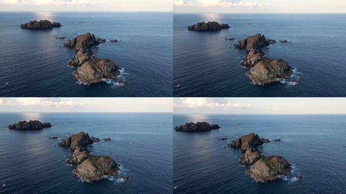 小岩石岛屿的无人机轨道视图
