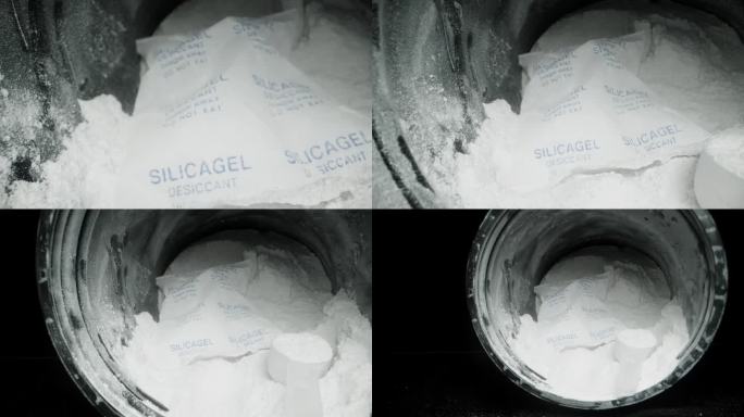 用硅胶包在一个装有白色肌酸粉末的罐子里。干燥剂表明它不是用于食物的。多莉滑块，近一点。